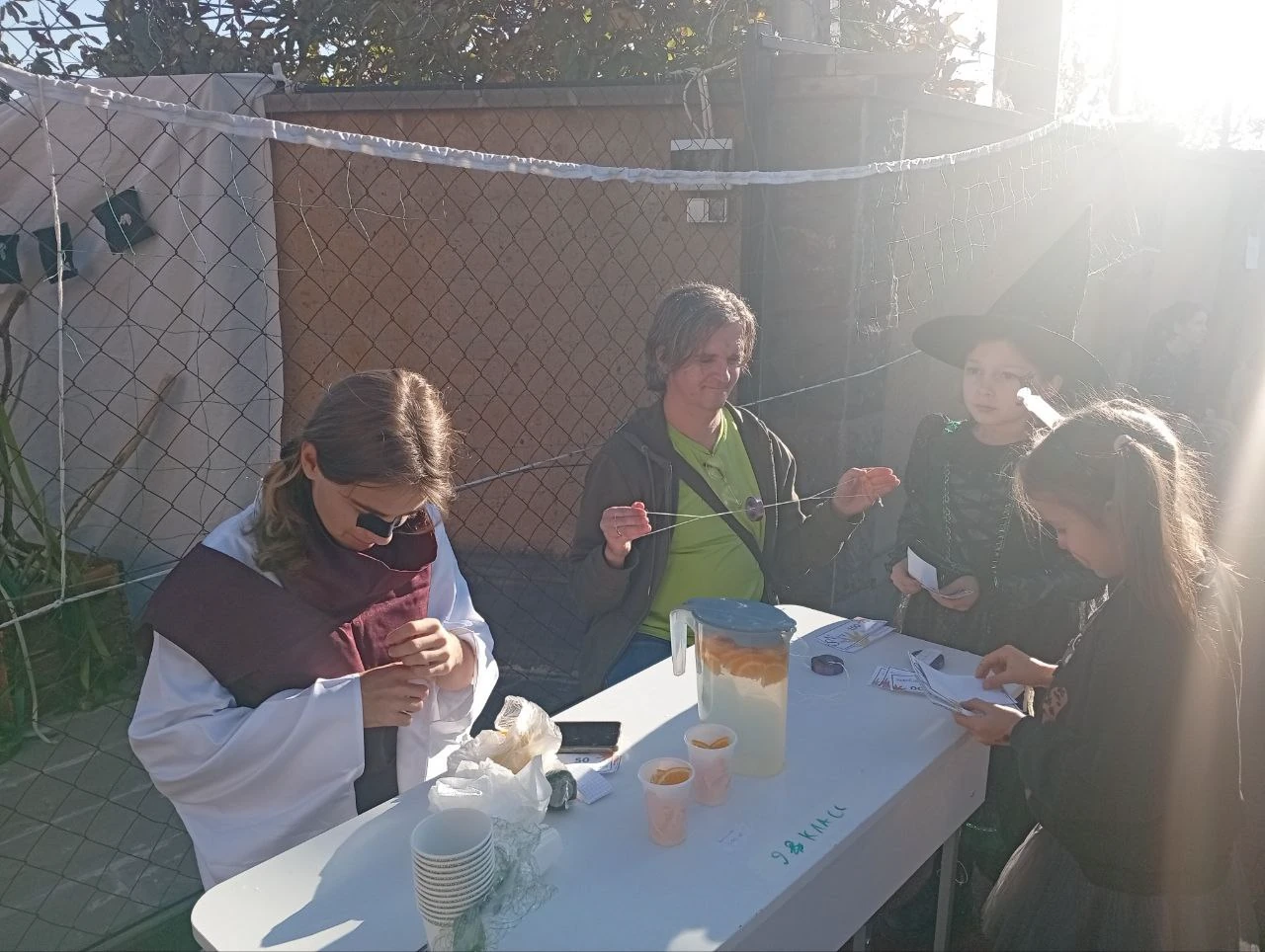 Halloween charity fair table with pumpkins and homemade treats